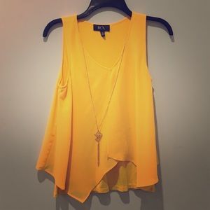 Yellow top with gold necklace attached